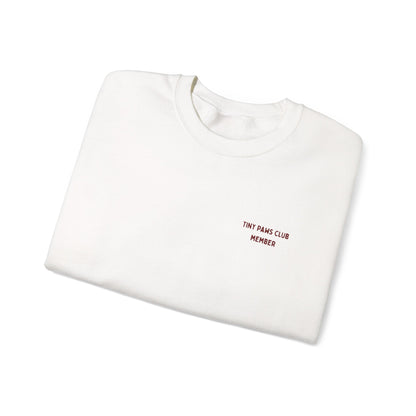 White sweatshirt with 'TINY PAWS CLUB MEMBER' text on a white background