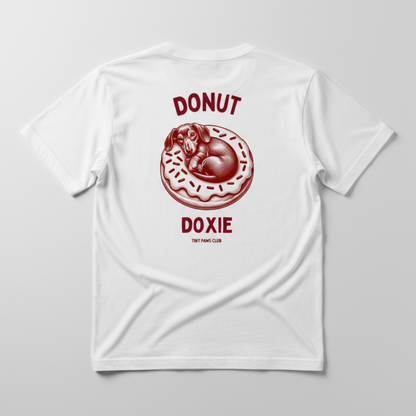White t-shirt with red graphic of a dog on a donut and text on a gray background
