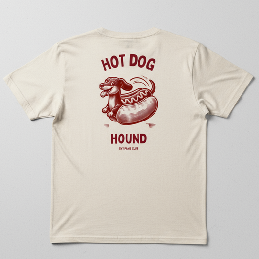 Beige t-shirt with a red hot dog graphic and text on a gray background