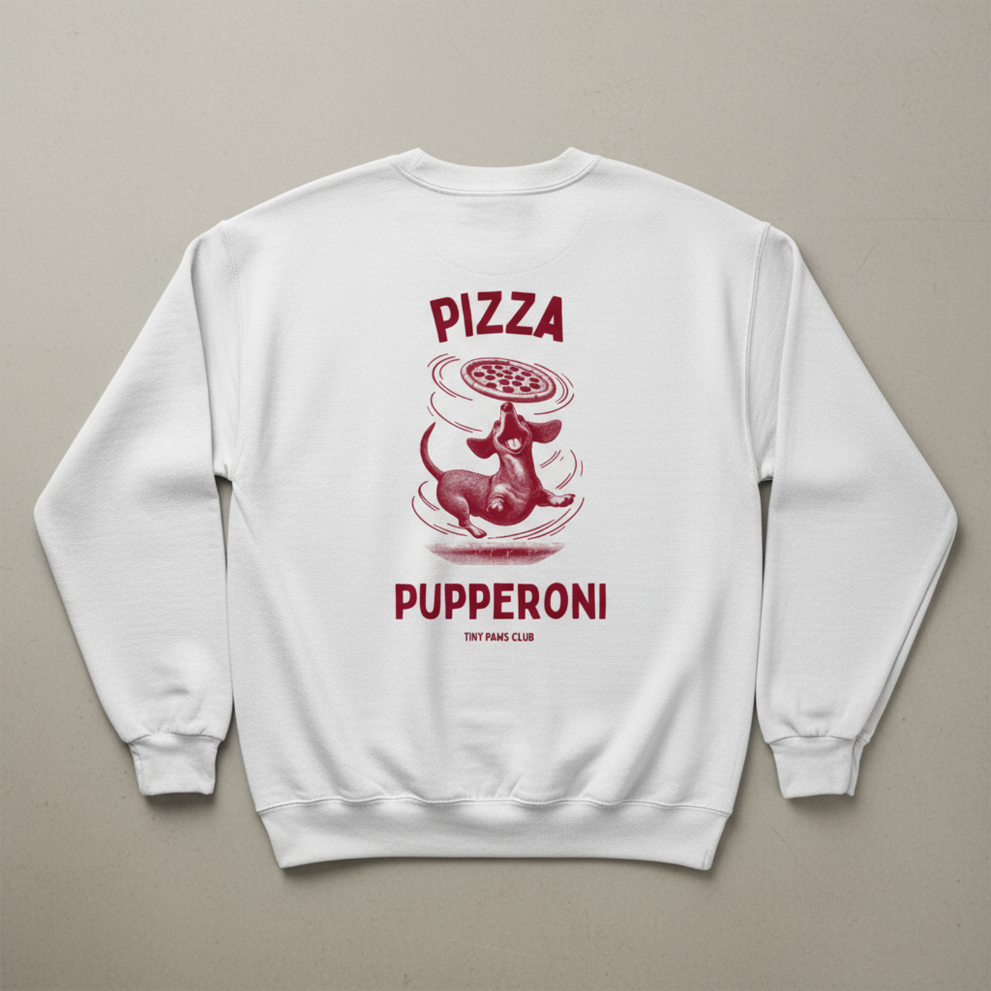 White sweatshirt with red graphic and text on a gray background dachshund crewneck sweatshirt